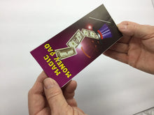 Person holding a purple card with money graphics and text on a white background
