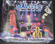 Packaging of a magic tricks set for kids with various props and a magician silhouette.