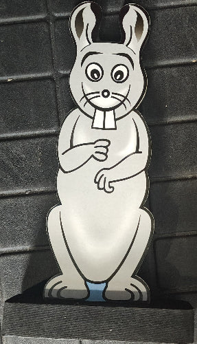 Metallic cartoon character on a textured black surface