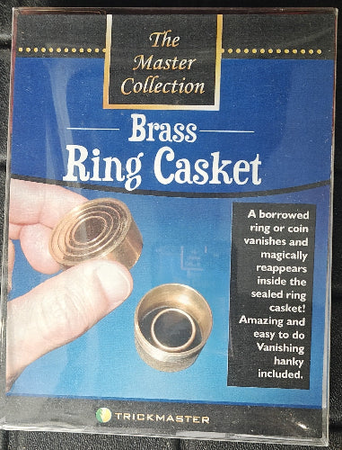 Brass ring casket packaging with text and images of a hand holding the casket.