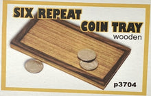 Wooden coin tray with coins on a white background