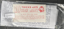 Vintage stage money with instructions and branding in a clear plastic bag.