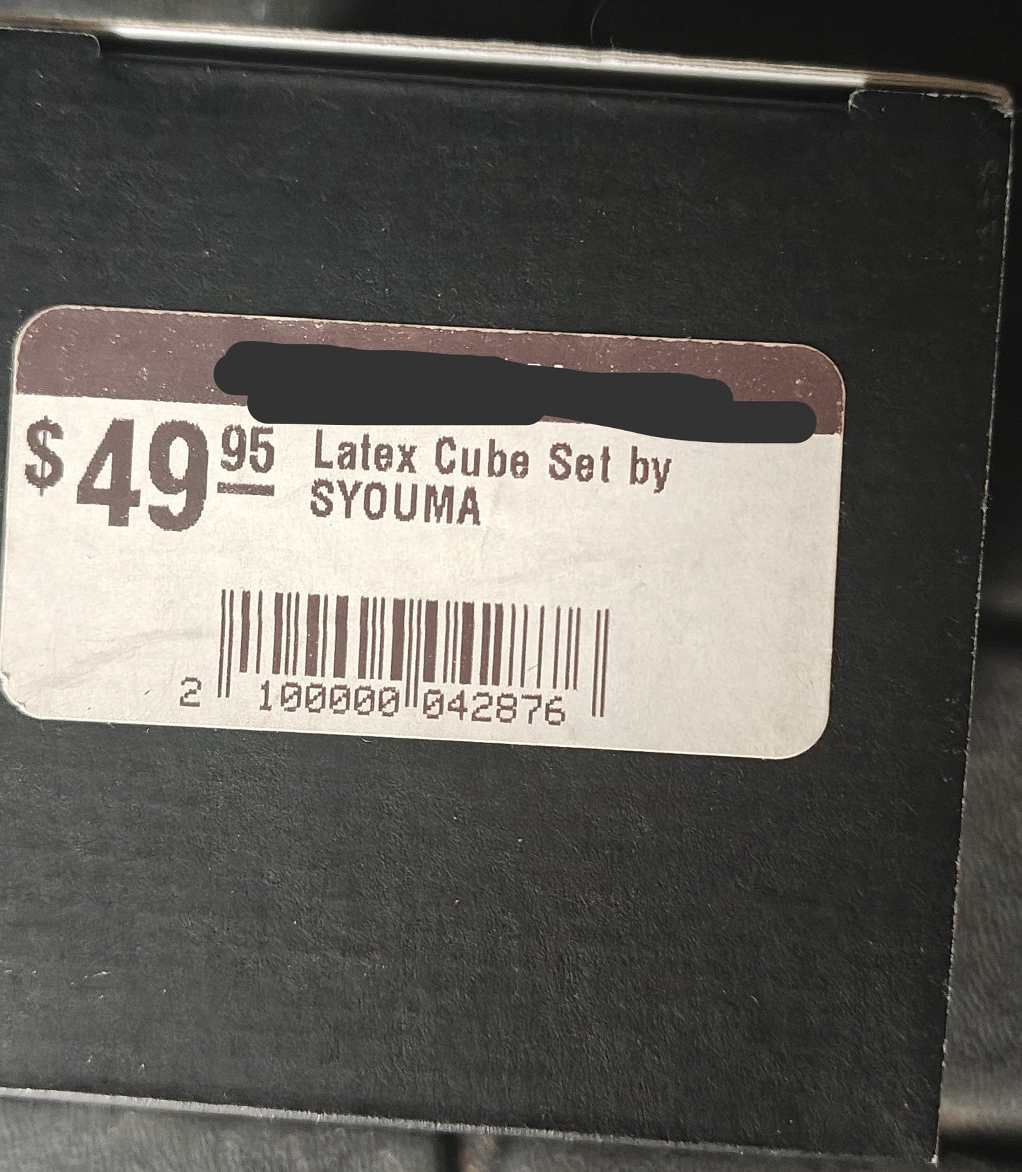 Price tag for a latex cube set by SYOUMA from the MagicKits.com Magic Shop on a black background.