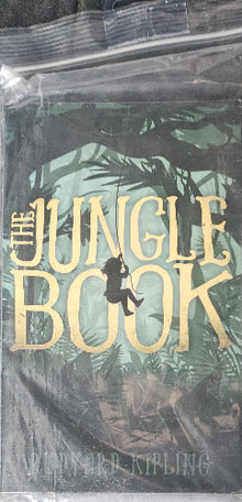 Book cover of 'The Jungle Book' by Rudyard Kipling with a silhouette of a child in the jungle.