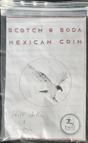 Packaged Mexican coin with 'Scotch & Soda' branding and an eagle illustration.