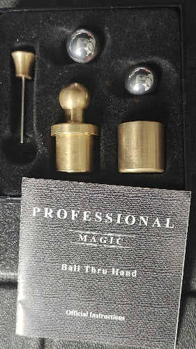 Set of brass with a black box labeled 'Professional Magic' on a dark background