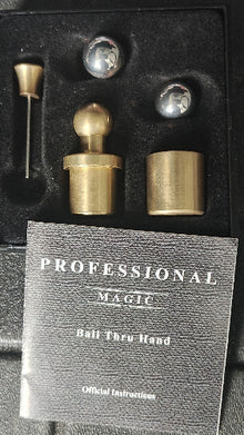 Set of brass with a black box labeled 'Professional Magic' on a dark background
