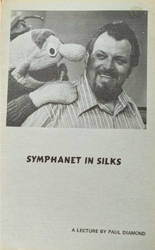 Black and white photo of a man with a puppet, titled 'Symphanet in Silks' by Paul Diamond.