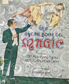 Vintage book cover of 'The Great Book of Magic' with illustrations of a woman and a man.