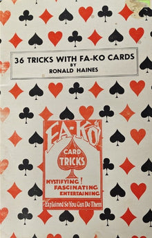 Card trick book cover with playing card symbols and text