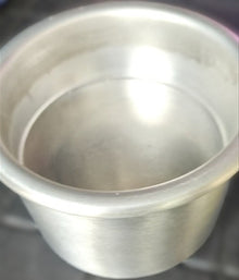 Close-up of a metallic cylindrical object with reflective surface