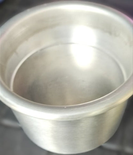 Close-up of a metallic cylindrical object with reflective surface