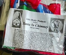 Set of colorful silks with a Santa in Chimney scenario and Ickle Pickle Products packaging.