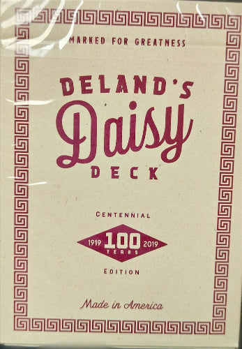 Packaging of Deland's Daisy Deck with decorative elements and text.
