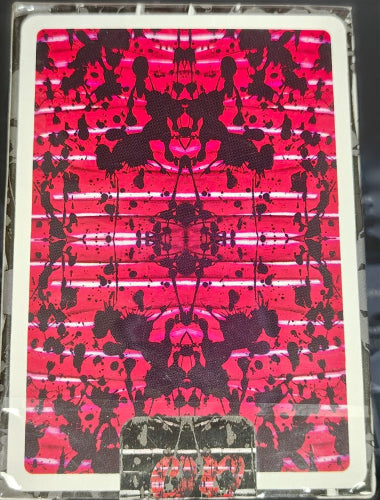 Abstract design with black and red patterns on a rectangular card.