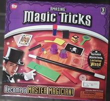 Box of 'Amazing Magic Tricks' set with magicians and props on a purple and red background.