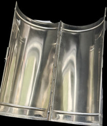 Metallic exhaust tip on a textured black surface with 'The Linking Ring' branding.