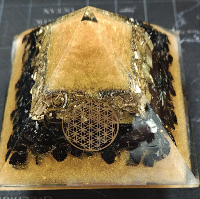 Decorative item with geometric design on a black surface