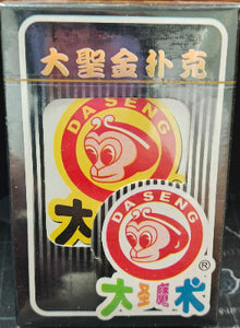 Card game packaging with brand logo on a wooden surface