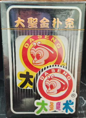 Card game packaging with brand logo on a wooden surface