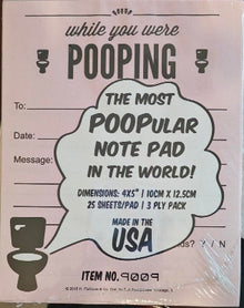 Note pad with humorous text on a wooden surface