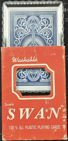 Red packaging of Swan playing cards with blue card design on a black background