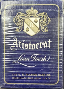 Aristocrat playing card box with a crest and text on a blue background