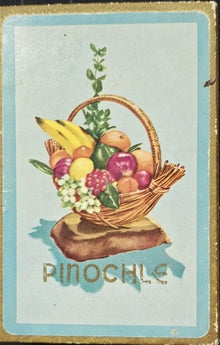 Vintage card with a basket of fruit and flowers labeled 'Pinochle'.