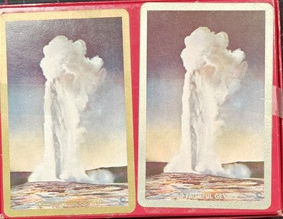 Stylized depiction of a geyser on a card with a red border
