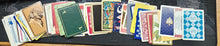 Collection of vintage playing cards on a dark surface