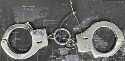 Handcuffs on a map background