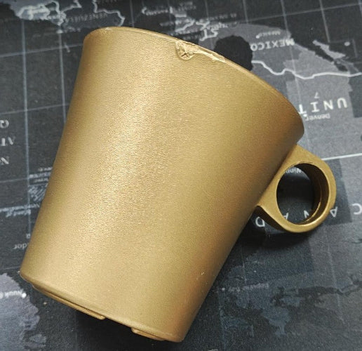 Gold cup holder on a map background