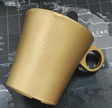 Gold cup holder on a map background