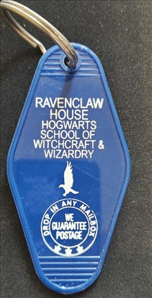 Blue keychain tag with 'Ravenclaw House' text and logo on a dark background