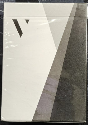 Product packaging with a geometric design and letter 'V' on a white and gray background