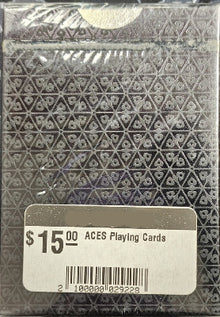 Packaged playing cards with a geometric pattern and 'Iowa Magic Shop' label.