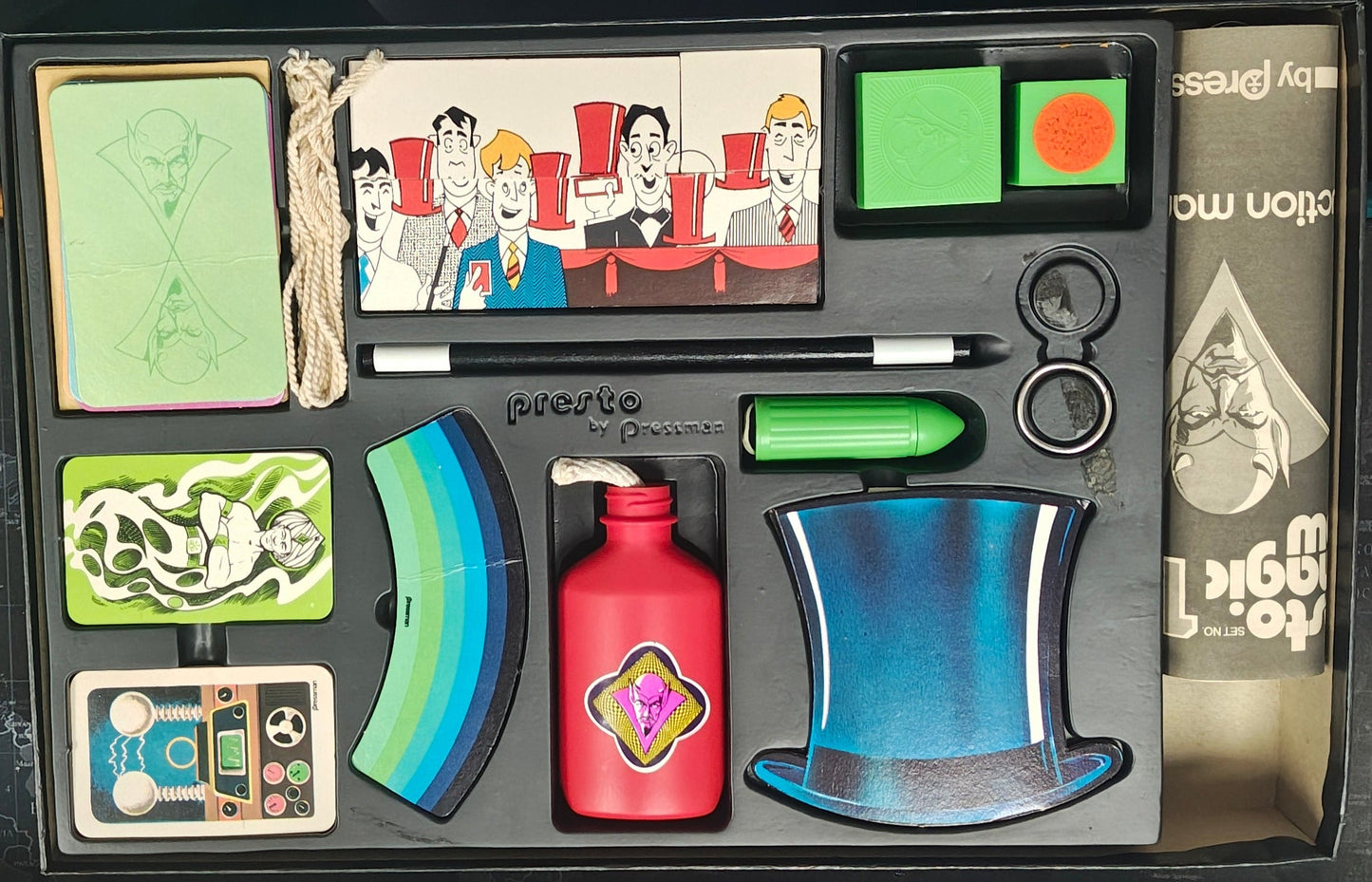 Collection of fantasy-themed figurines and accessories in a box on a desk.