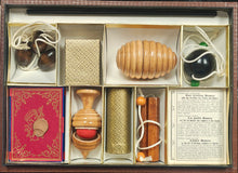 Decorative box with compartments containing various items on a map background