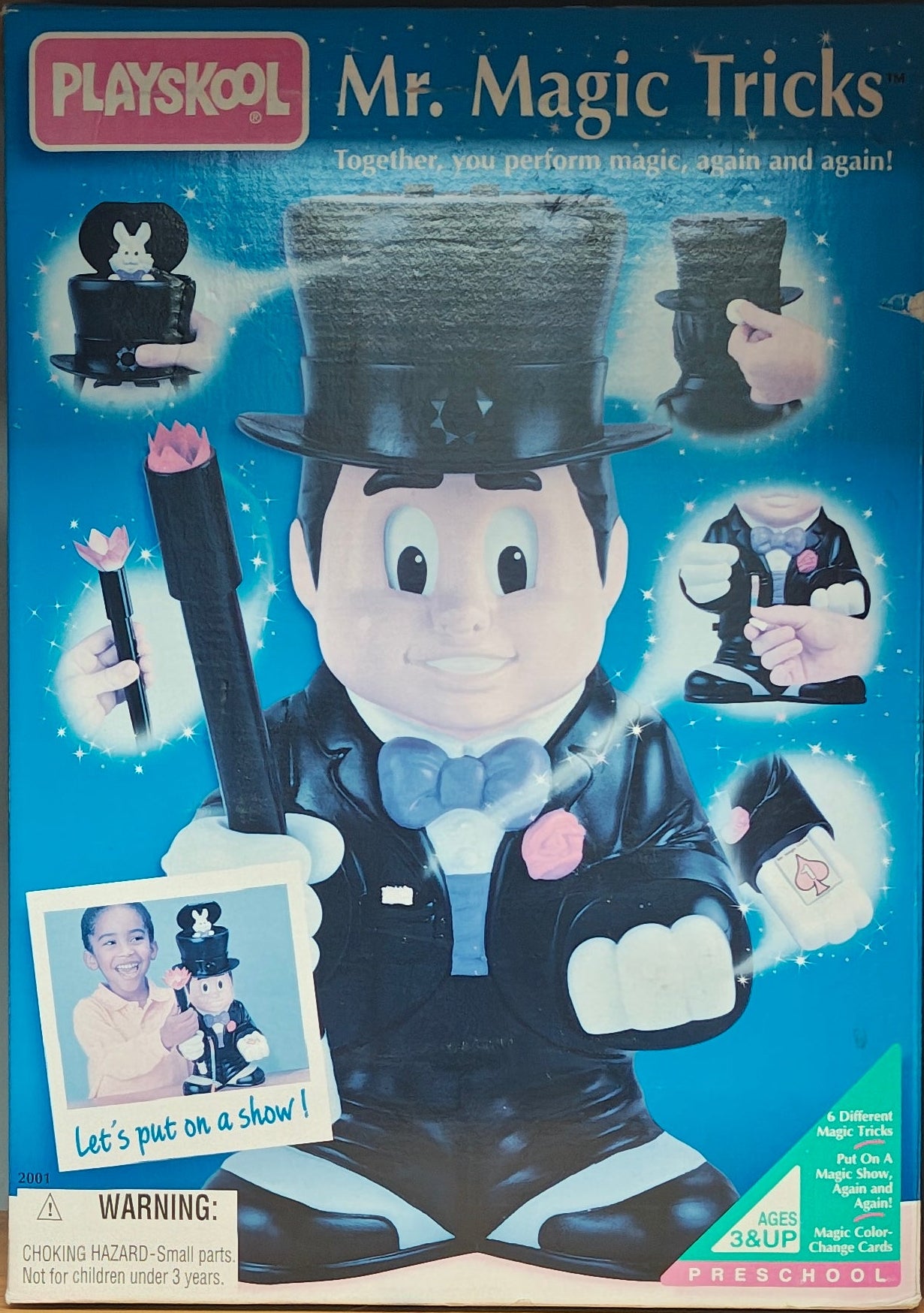 Cardboard box with 'Mr. Magic Tricks' on a wooden shelf