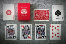 Collection of playing cards with Mindset branding on a textured surface