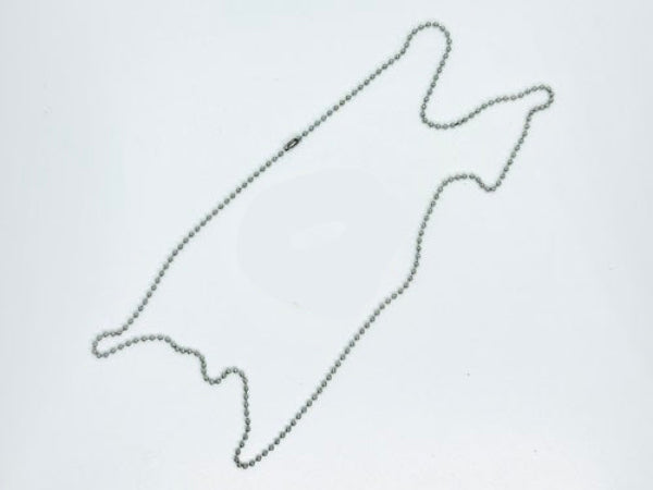 Metallic chain with a round ring on a white background