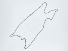 Metallic chain with a round ring on a white background