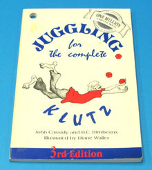Book titled 'Juggling for the Complete Klutz' on a blue background