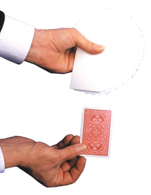 Hand holding a red playing card with a white background