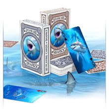 Shark-themed playing cards with packaging on a water-themed background