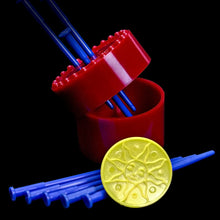 Red container with blue straws and a yellow lid on a black background