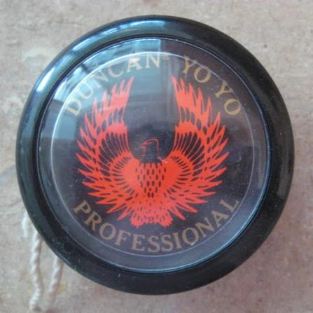 Black Duncan yo-yo with red logo on a brown background