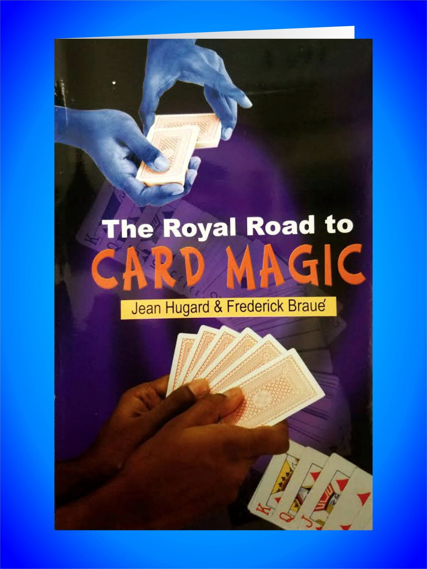 Book cover of 'The Royal Road to Card Magic' with images of hands holding cards on a blue background.