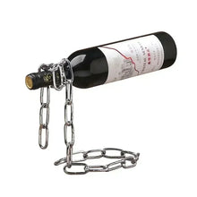 Wine bottle chained to a metal chain on a white background