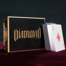 Diamond playing card box with a deck of cards on a dark background